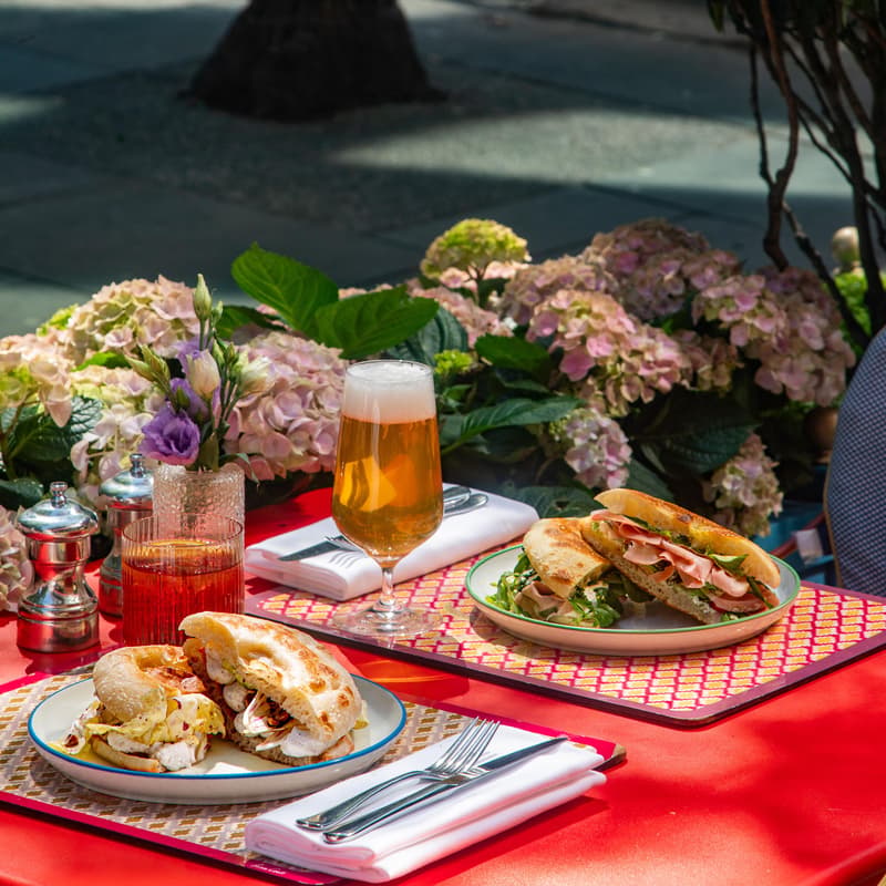 Al fresco lunch with gourmet sandwiches and beer outside Broadwick Soho in Soho London